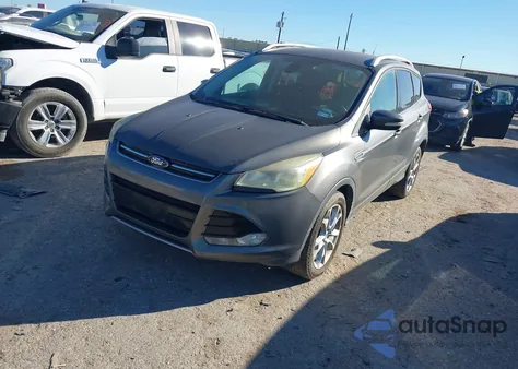 2014 Ford Escape Titanium z USA, uszkodzony, nr VIN 1FMCU0J99EUB62087